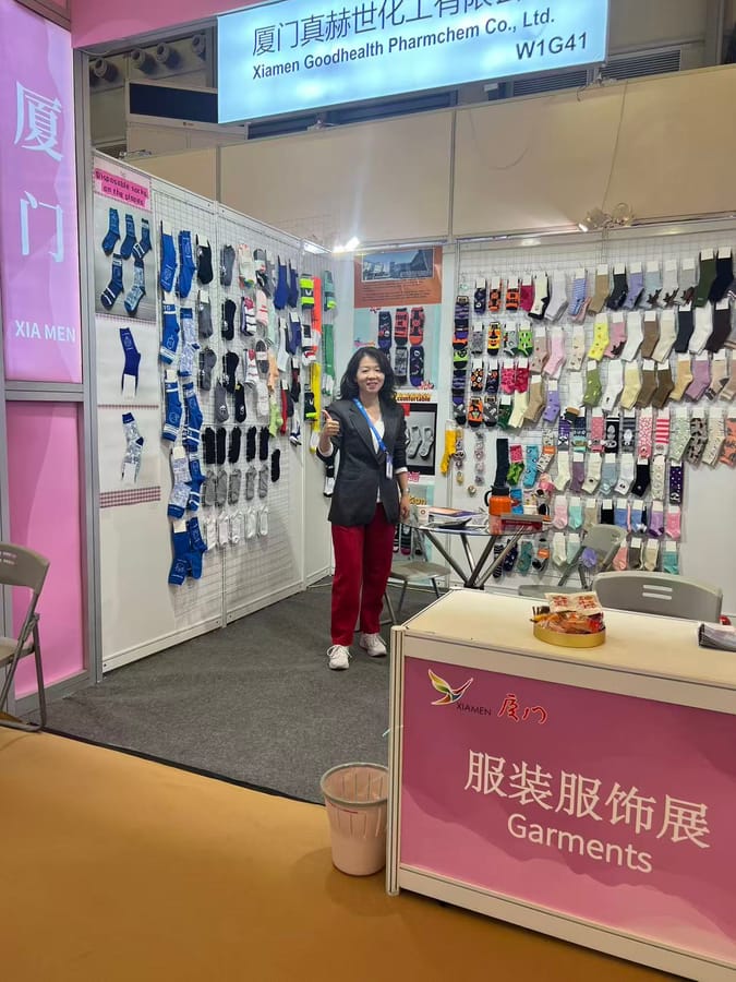 ANV Socks representative at the East China Fair booth presenting disposable airline socks and fashion sock samples