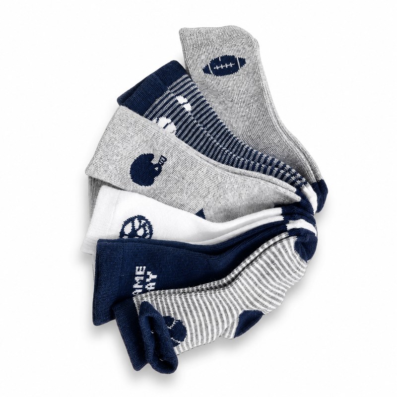 Boys Sport Theme Socks by ANV Socks — Cotton blend. Five-pair pack of boys' sport-themed crew socks with football, basketball, and helmet motifs in navy and grey. Durable cotton blend for active kids. Ideal for multi-pack retail and back-to-school programs.
