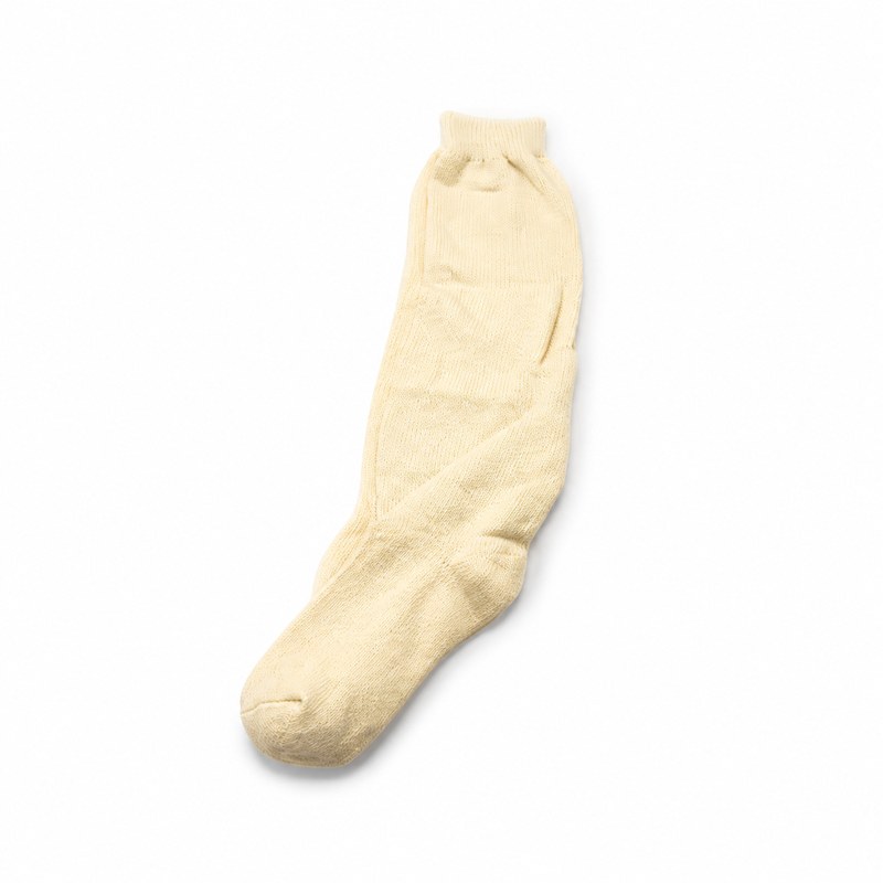 Plain Knee-High Socks by ANV Socks — Cotton + polyester blend. Classic solid-color knee-high socks in black, cream, grey, and white. Versatile wardrobe staple suitable for supermarket chains, department stores, and school uniform programs.