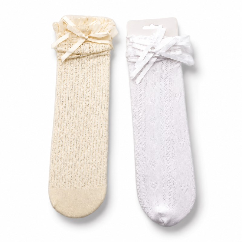 Ribbon Lace Knee-High by ANV Socks — 100% Nylon. Lace knee-high socks with ribbon bow accents and ruffle tops in cream and white. Decorative and elegant design for boutique fashion, bridal accessories, and specialty gift retail.